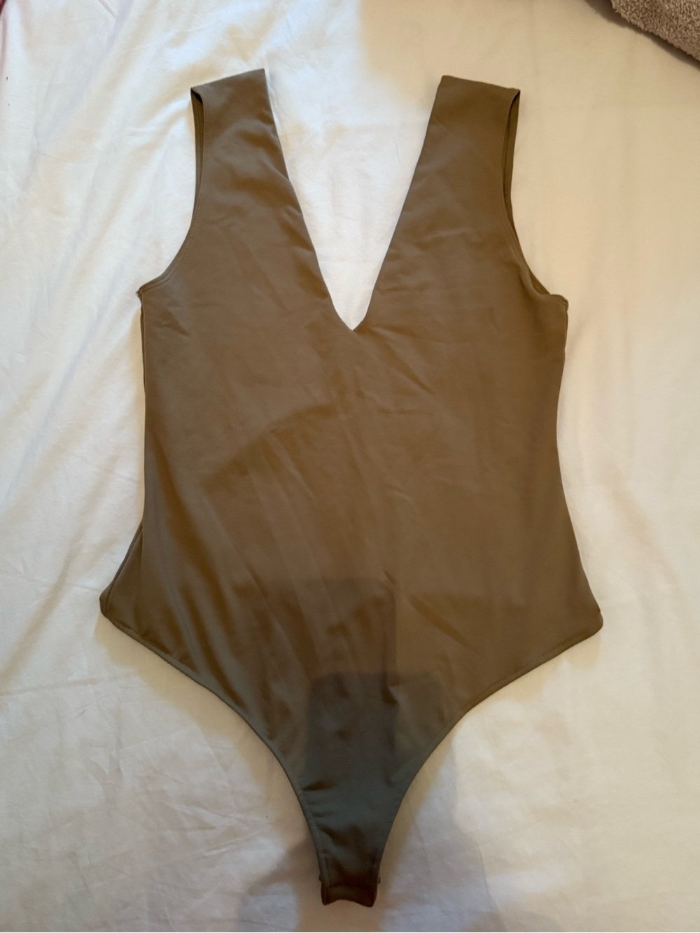 Free People Women’s tan V-Neck bodysuit